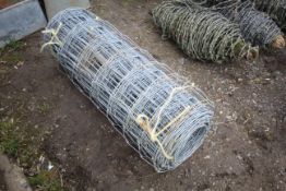Roll of stock fencing.