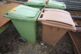 Green and brown wheelie bins.