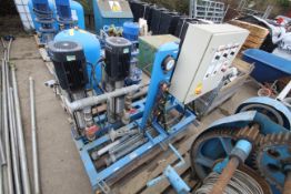 Pumpset with twin pumps, pressure vessel, control