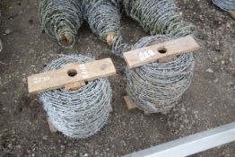 Two rolls of barbed wire.