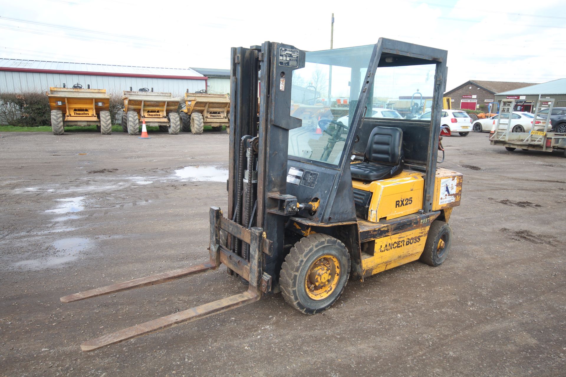Lancer Boss RX25L 2.5T gas yard forklift. 7,027 hours. With Nissan engine and triplex mast. Key