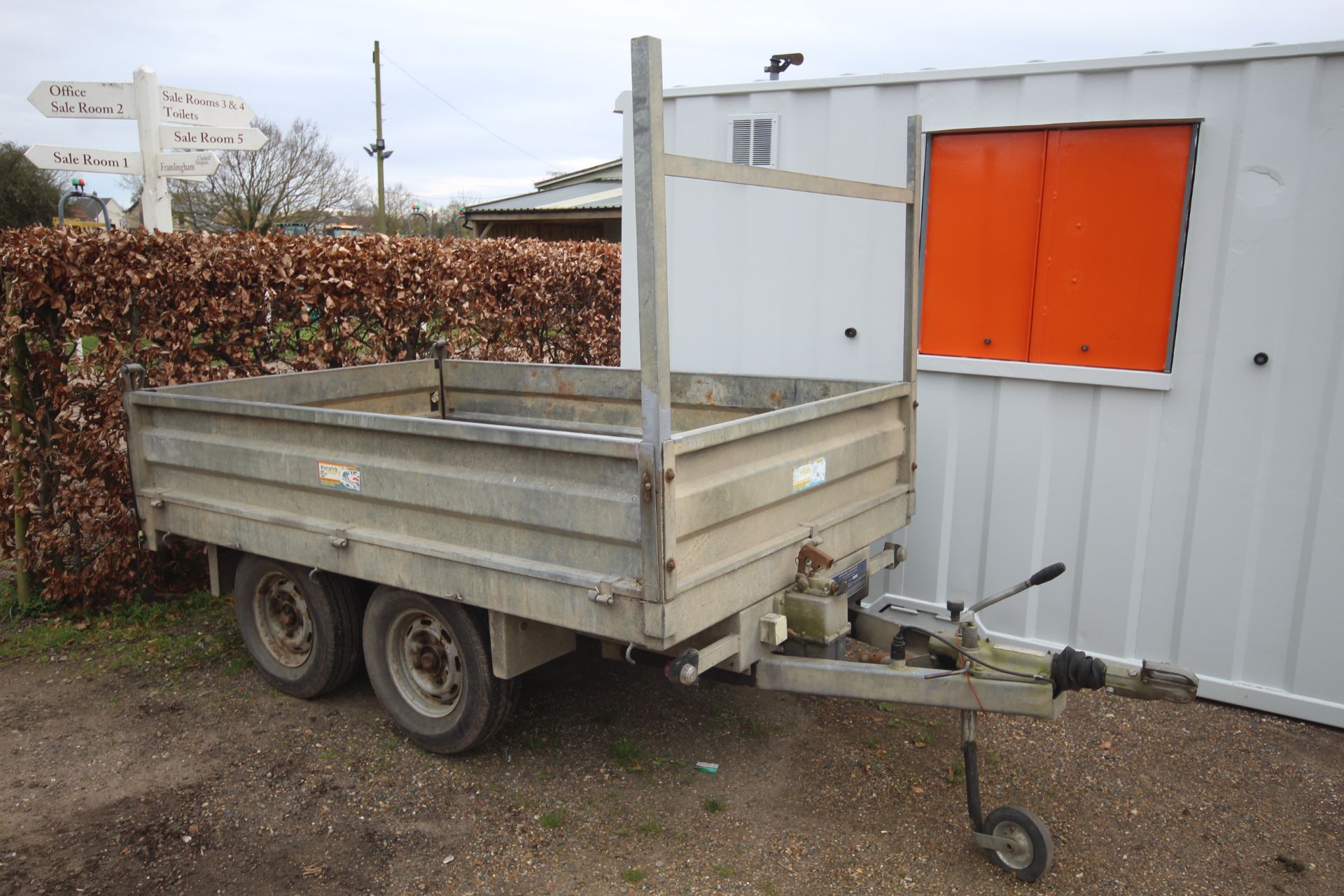 Warwick 8ft x 5ft twin axle flatbed tipping trailer. With drop sides. Control box held.