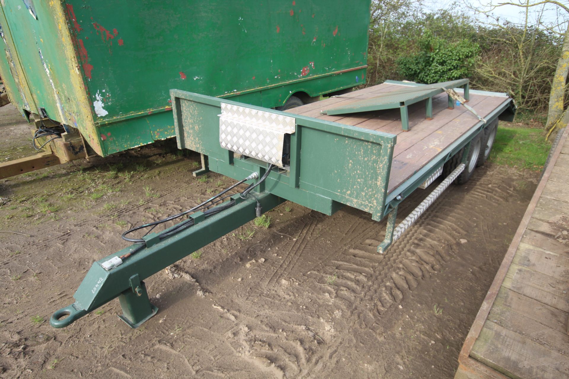 16ft twin axle engineer-built beaver tail low loader. With cheese wedge, ramps, oil brakes and