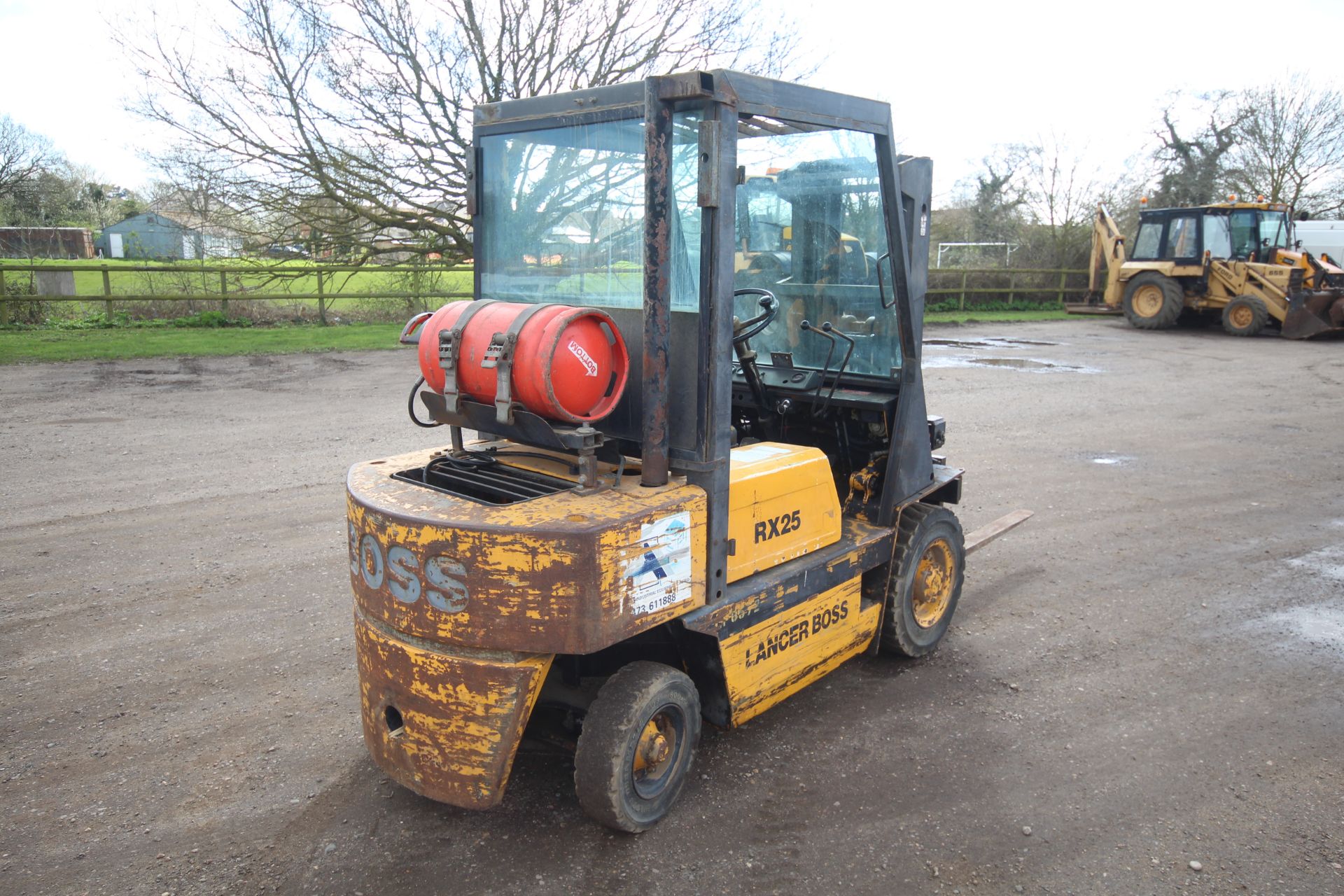 Lancer Boss RX25L 2.5T gas yard forklift. 7,027 hours. With Nissan engine and triplex mast. Key - Image 3 of 53