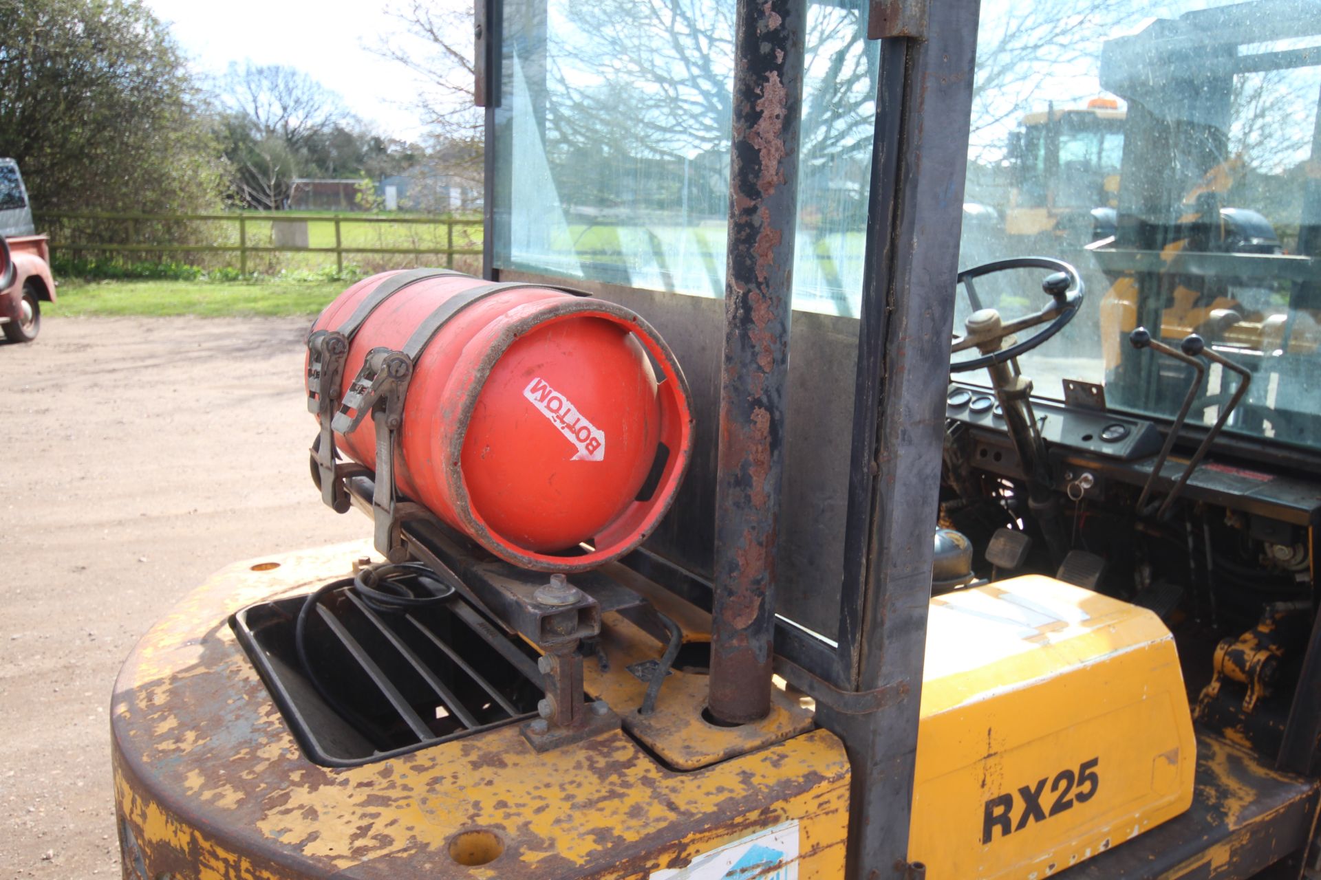 Lancer Boss RX25L 2.5T gas yard forklift. 7,027 hours. With Nissan engine and triplex mast. Key - Image 20 of 53