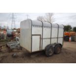 Twin axle livestock trailer.