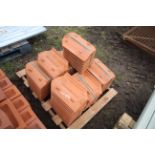 Pallet of roofing tiles.