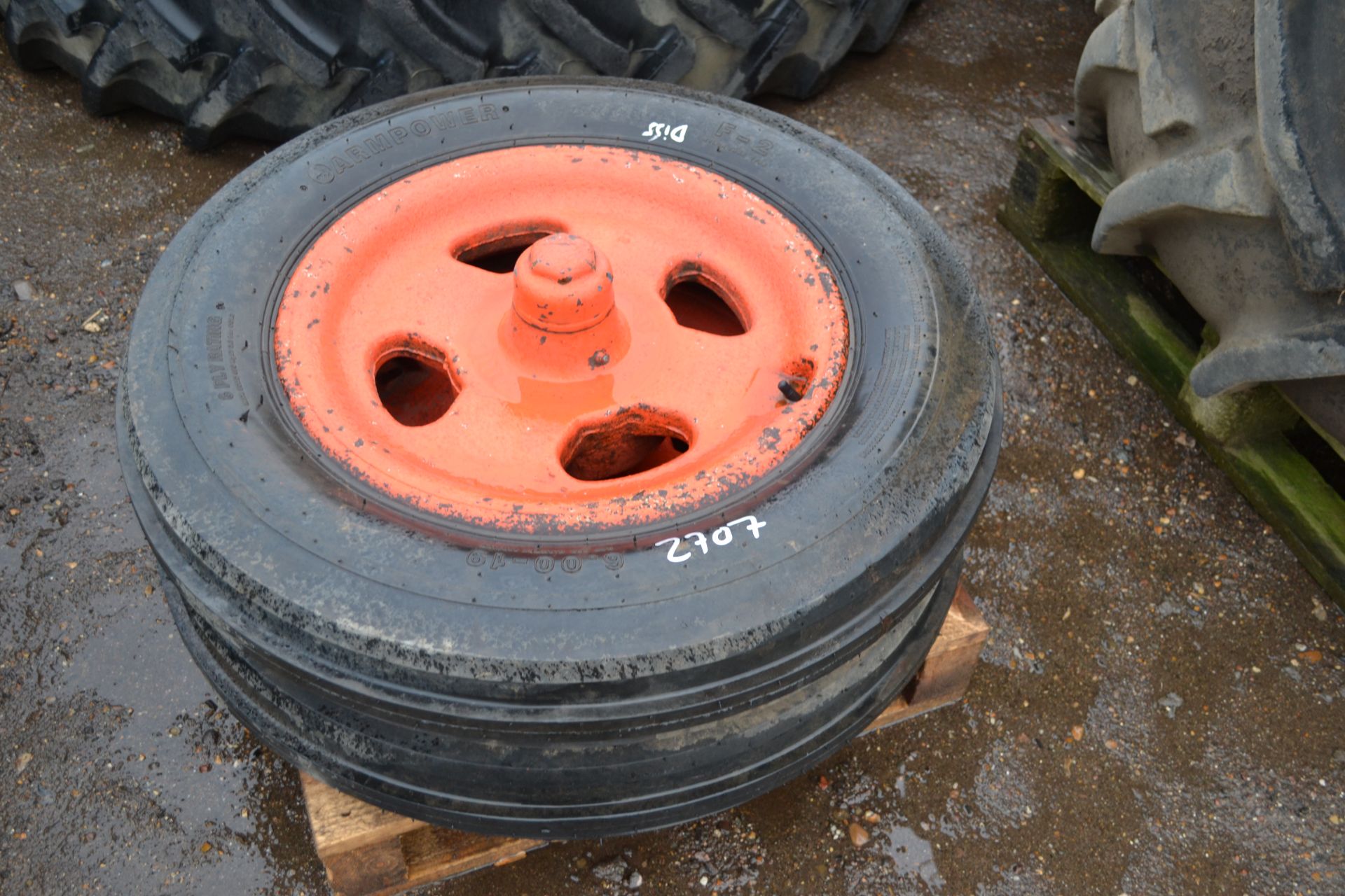 Pair of 6.00-19 Fordson cast iron front wheels and unused tyres.