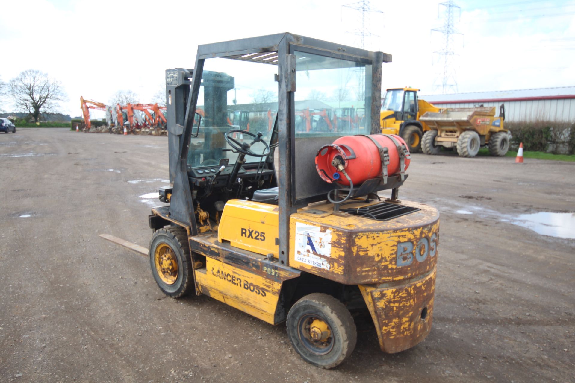 Lancer Boss RX25L 2.5T gas yard forklift. 7,027 hours. With Nissan engine and triplex mast. Key - Image 2 of 53