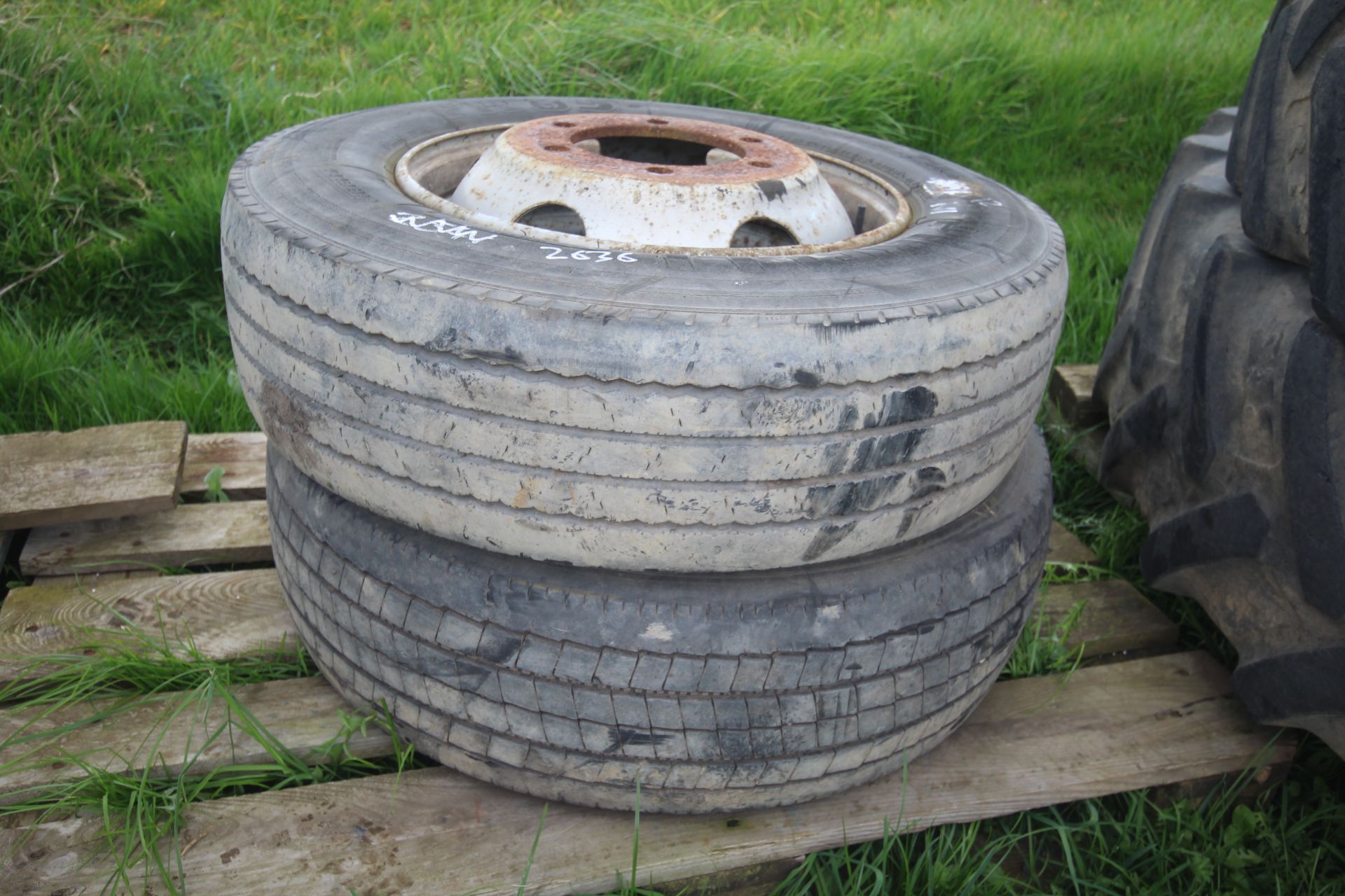 235/70R17.5 lorry wheel and tyre (requiring repair) and another.