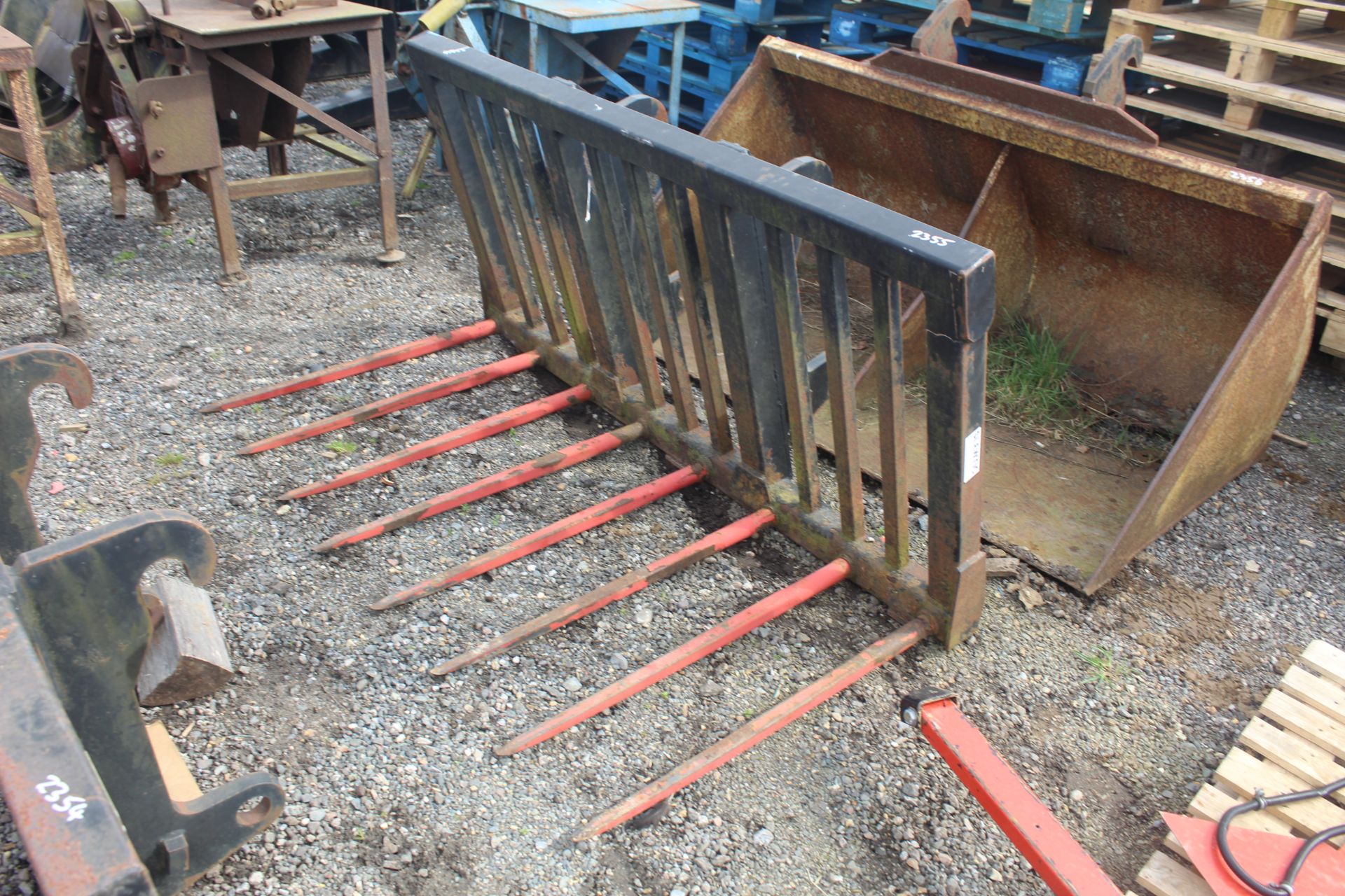 Slewtic muck fork. CAT telehandler brackets. V