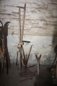 Various garden tools including scythes and shears