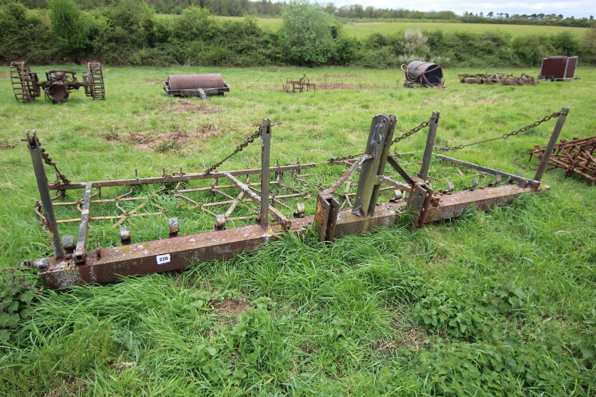 Farm made heavy duty mounted seed harrow.