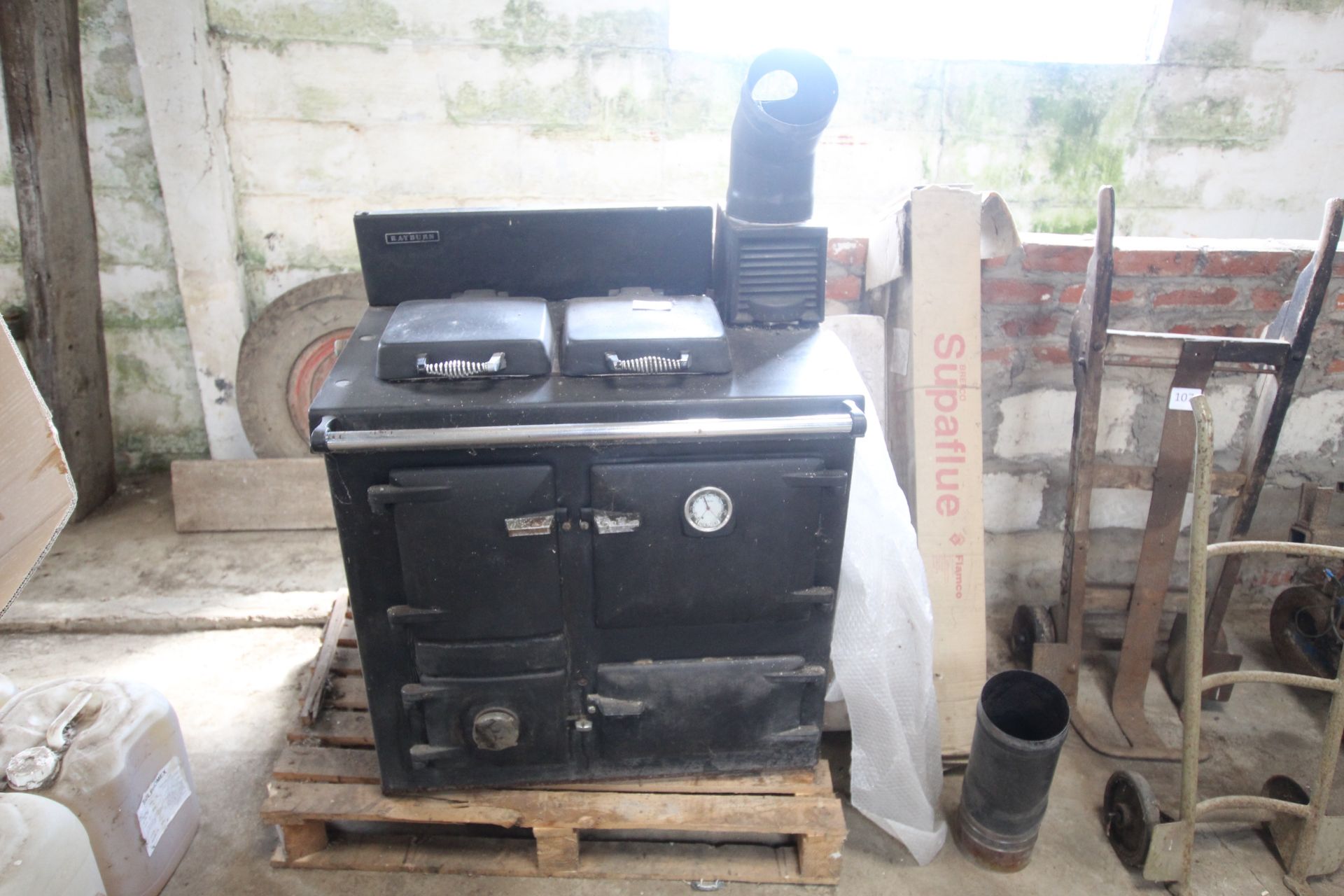 Solid fuel Rayburn and various flue parts.