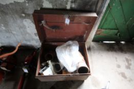 Tin trunk with various drainage pipe fittings etc.
