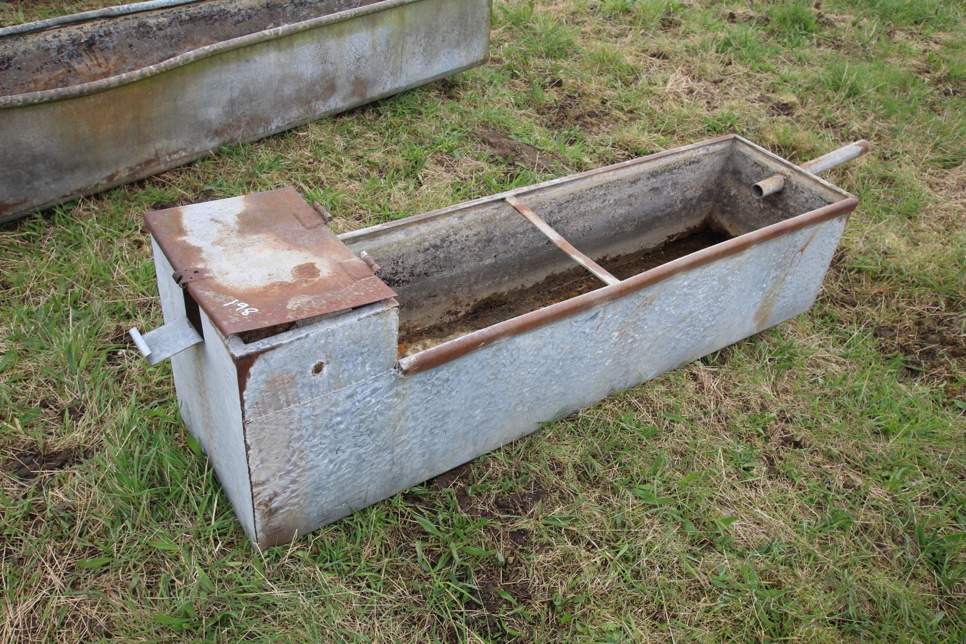 Galvanised water trough.