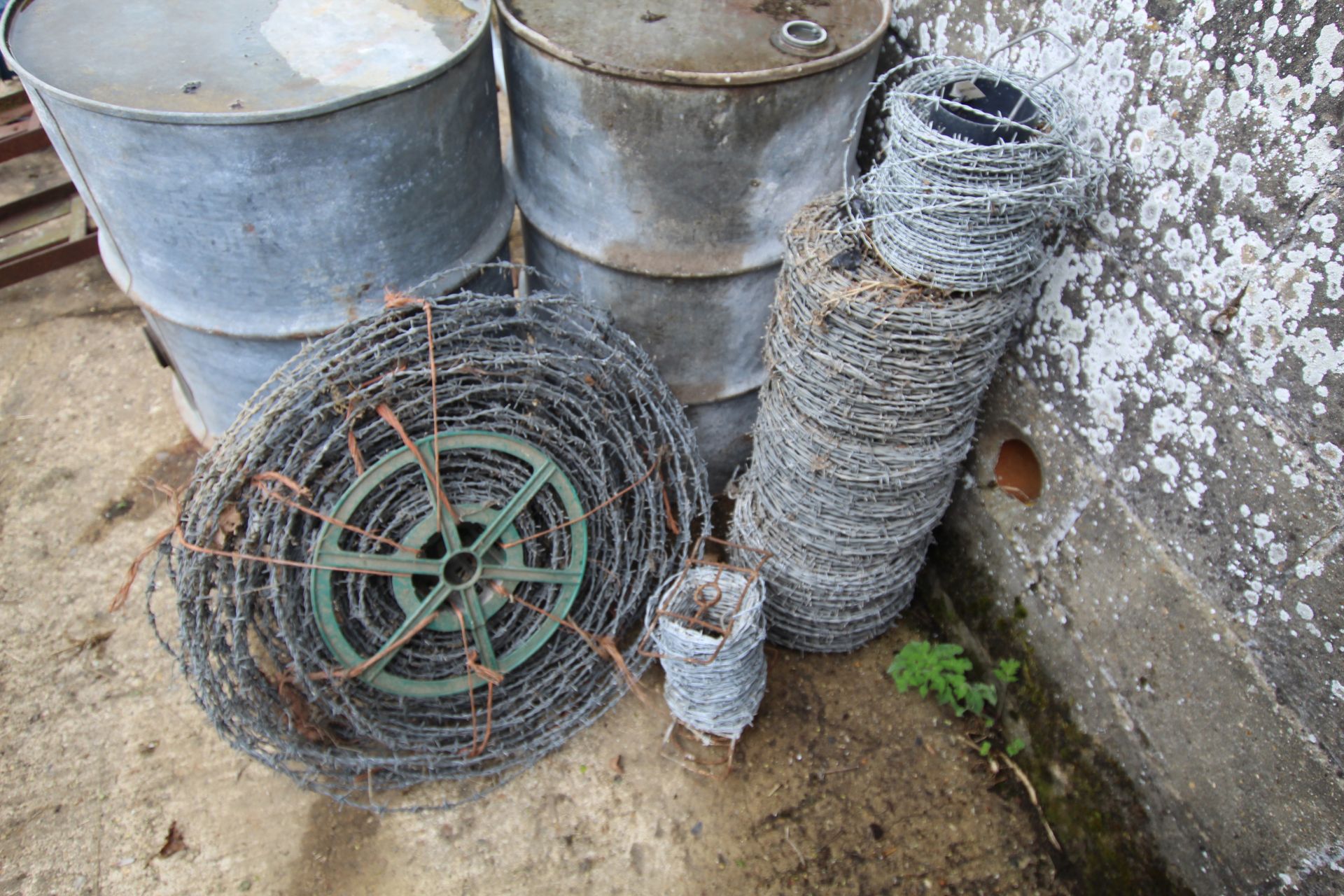 Unused and used barbed wire.