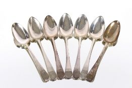 Seven various George III "Old English" pattern silver table spoons, bearing family crests, 14oz