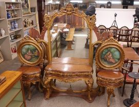 An ornate French walnut and gilt decorated dressing table, fitted with a serpentine fronted
