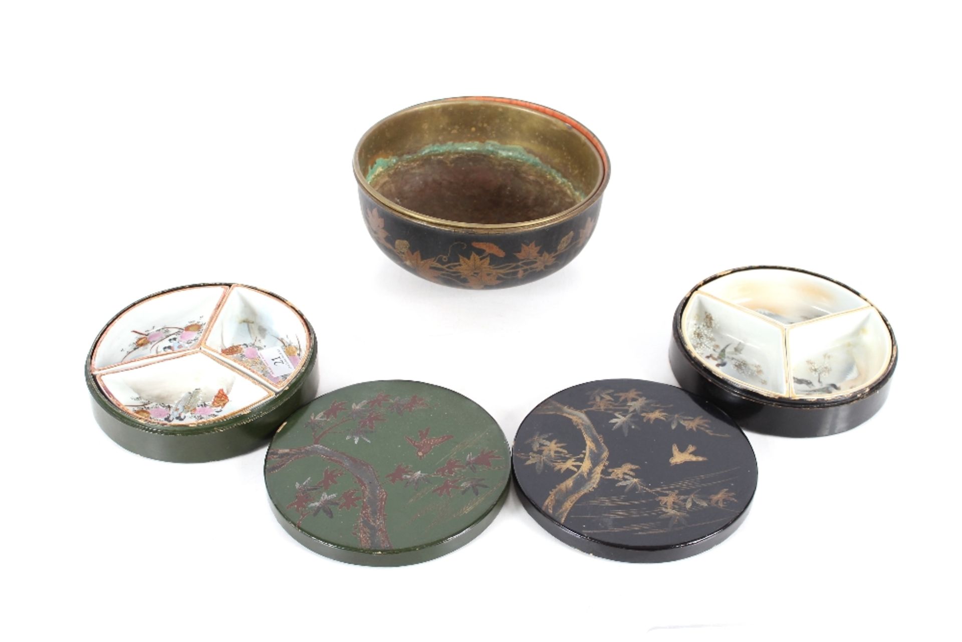 Two Japanese porcelain three section hors d'oeuvres sets, contained in circular lacquered boxes; and