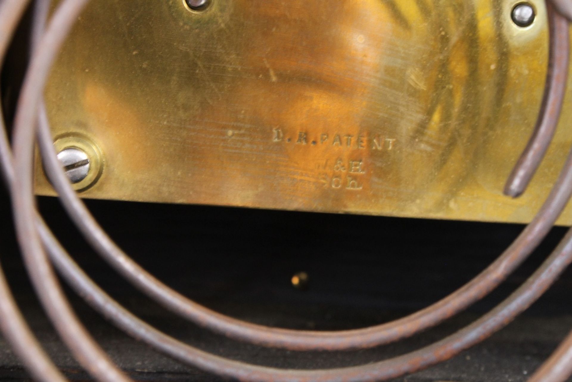 A large 19th Century ebonised mantel clock, the arched case supporting an ornate foliate brass - Image 12 of 12