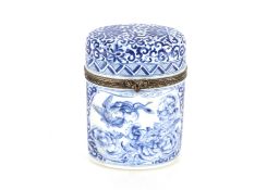 A Limoges porcelain blue and white needle case with hinged lid, profusely decorated flowers, 9.3cm