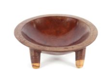 A Fijian wood Kava bowl, carved with four feet and two suspension holes, 31cm dia.