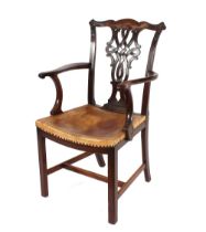 A set of eight mahogany dining chairs, in the Chippendale style, having foliate carved cresting