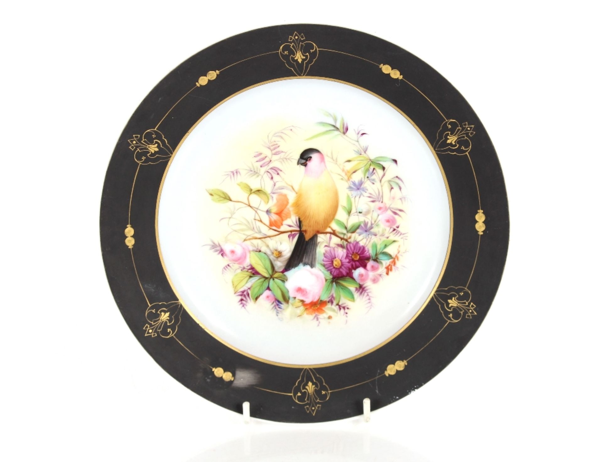 A late 19th Century continental porcelain cabinet plate, with central decoration of birds seated