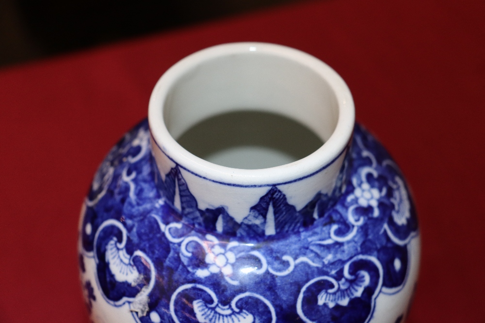 A Chinese blue and white garniture of vases, comprising baluster vase, decorated objects and foliage - Image 3 of 25