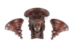 A 19th Century oak wall bracket, the semi-circular shelf supported by a female head, 21.5cm high;