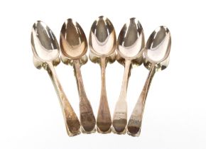 Five various George III silver table spoons, "Old English" and "Fiddle" pattern with crest and