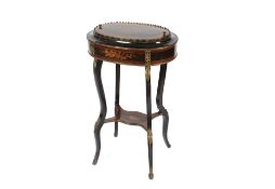 A 19th Century French walnut marquetry and ebonised oval jardinière, having pierced gallery and