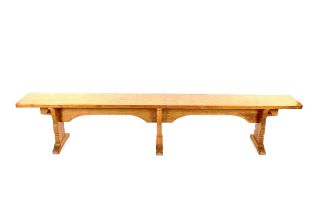 Workshop of Robert (Mouseman) Thompson of Kilburn, a large English oak bench, the top with adzed