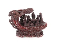 A carving in Sou Shan Stone of the eight immortals on a raft, contained in original display box
