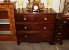 A 19th Century mahogany chest of two short and two long graduated drawers, raised on a shaped