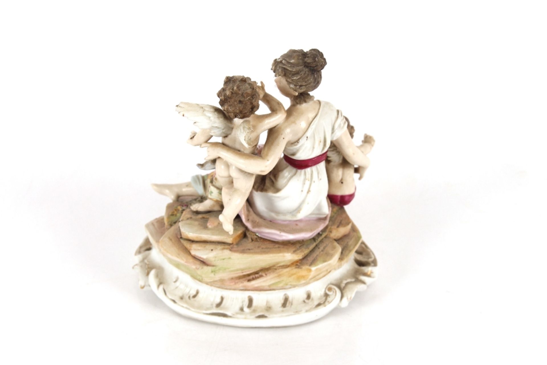 A small 19th Century German porcelain figure group, depicting maiden and cherubs, on a rock work - Image 2 of 4