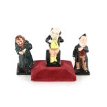 Three Royal Doulton figures, "Mr Pickwick", "Fagin" and "Mr Pecksniff"