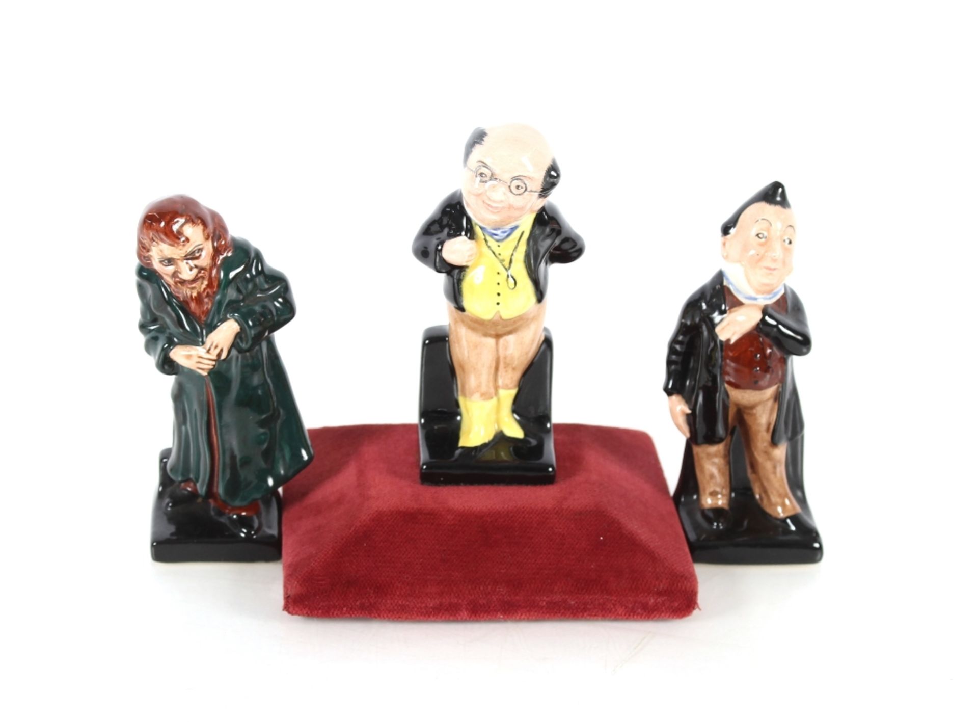 Three Royal Doulton figures, "Mr Pickwick", "Fagin" and "Mr Pecksniff"