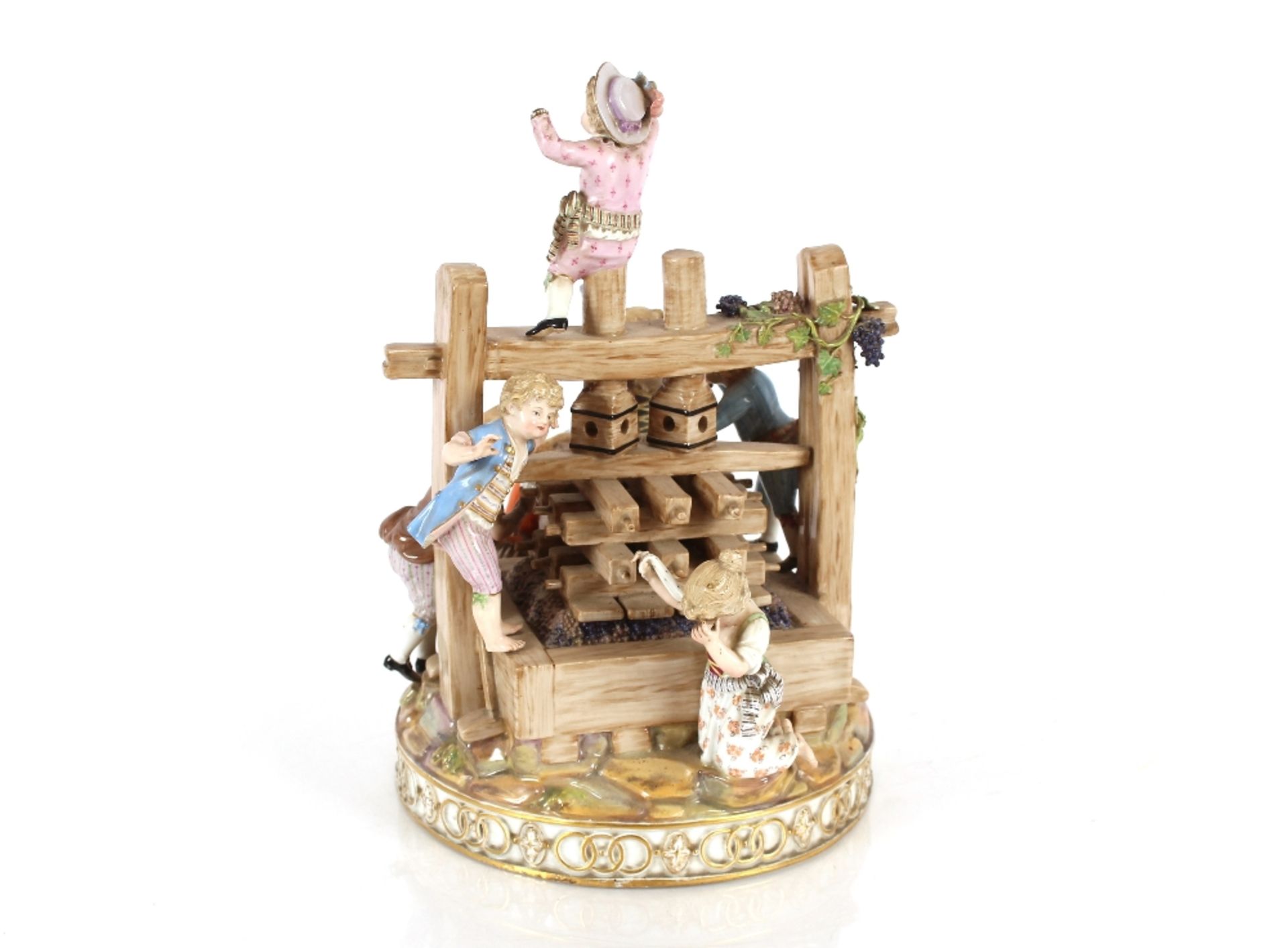 A 19th Century Meissen figure group, depicting children around a grape press, having encrusted - Image 2 of 8