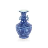 A 19th Century Chinese blue glazed baluster vase, decorated Dogs of Fo, flaming pearls and