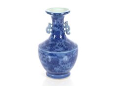 A 19th Century Chinese blue glazed baluster vase, decorated Dogs of Fo, flaming pearls and