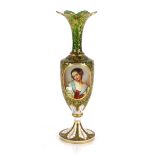 A 19th Century green overlaid glass baluster vase, decorated foliate and portrait panels richly