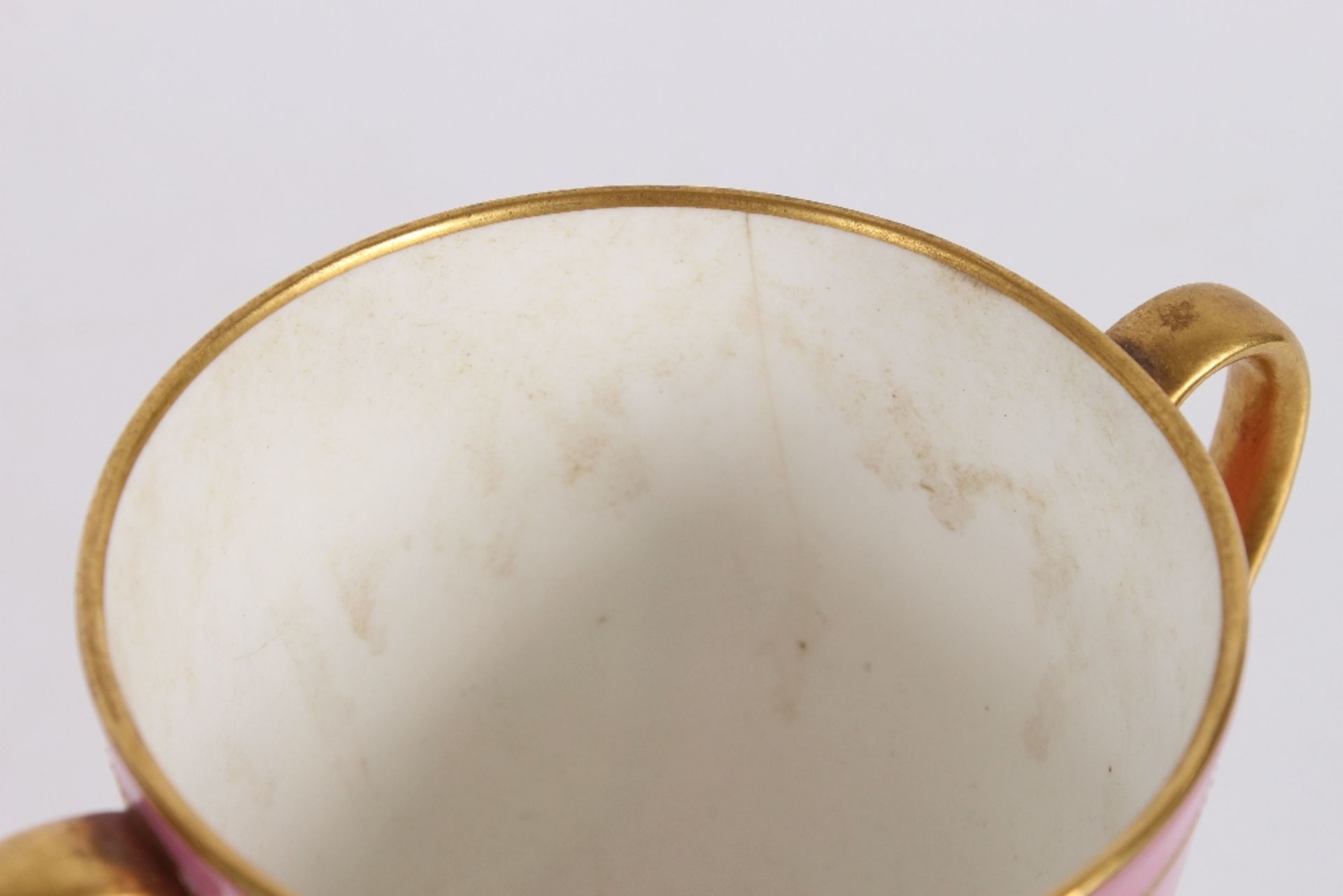 A 19th Century Minton's baluster cup, decorated with a finely painted foliate panel within gilt - Image 3 of 4