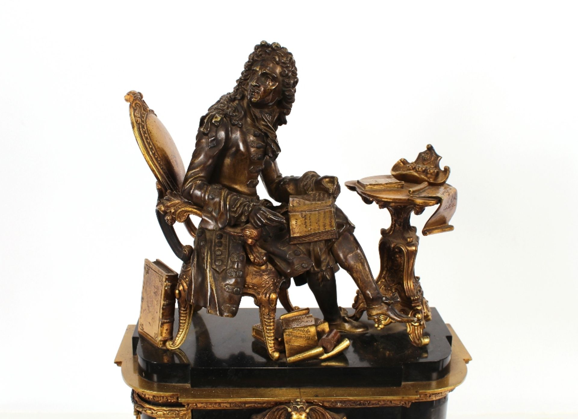 A 19th Century French black marble and Ormolu mounted mantel clock, surmounted by a seated bronze - Image 4 of 4