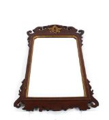 A 19th Century mahogany Chippendale style wall mirror, having fret carved frame with pierced gilt