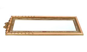A decorative French style gilt and pink painted pier mirror, with ribbon tied surmount, 152cm x 52cm
