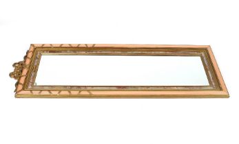 A decorative French style gilt and pink painted pier mirror, with ribbon tied surmount, 152cm x 52cm