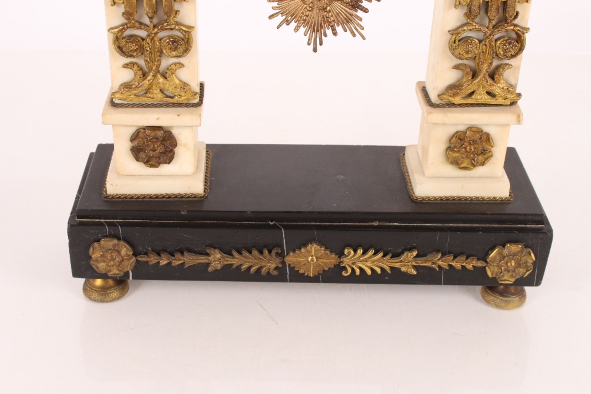 A 19th Century French marble and ormolu mounted mantel clock, surmounted by griffins and garlands, - Image 4 of 6