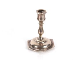 A miniature silver candlestick, Birmingham 1897; an Edwardian silver teaspoon in the form of an